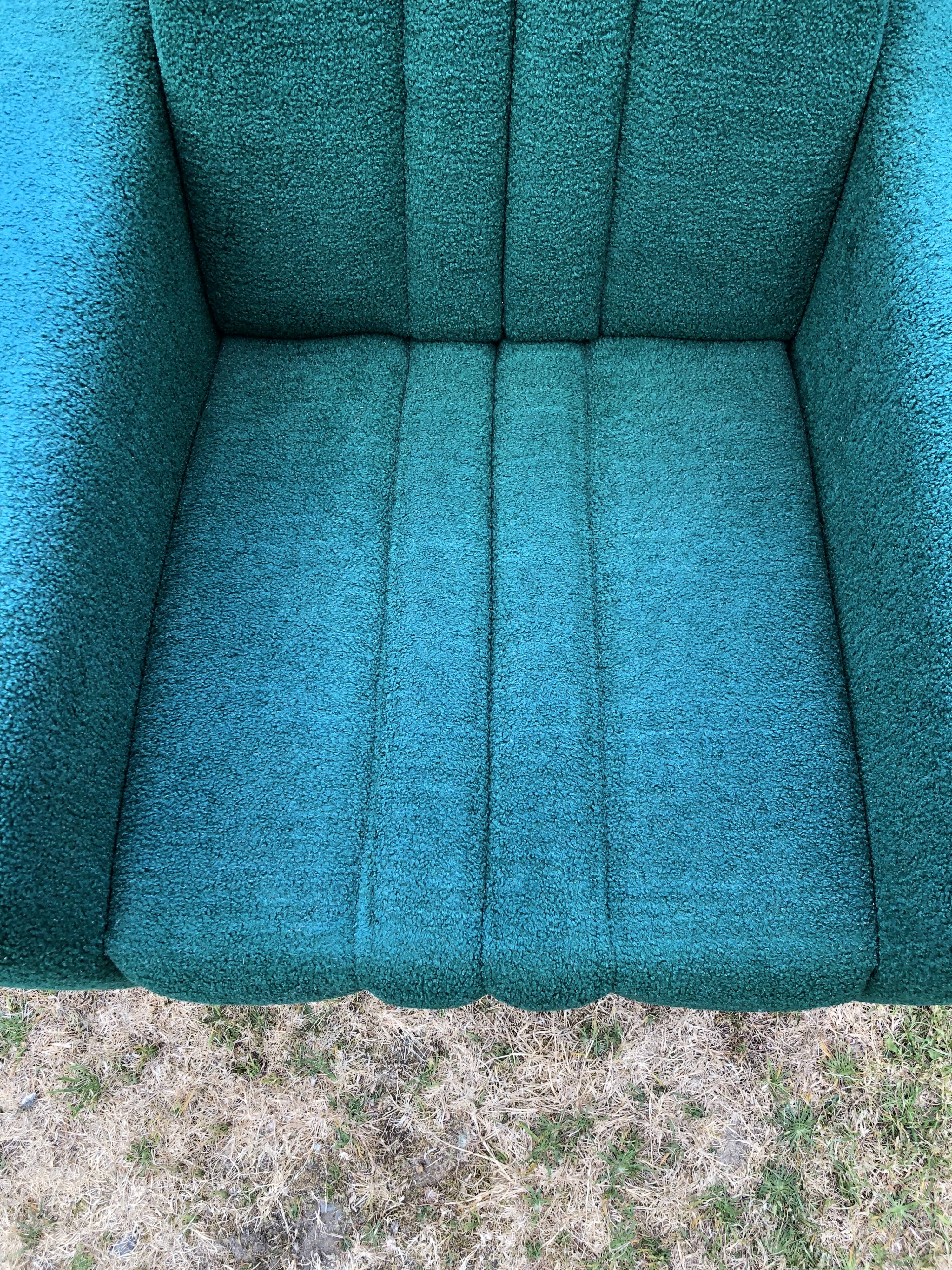 Duo of vintage armchairs with green fabrics.