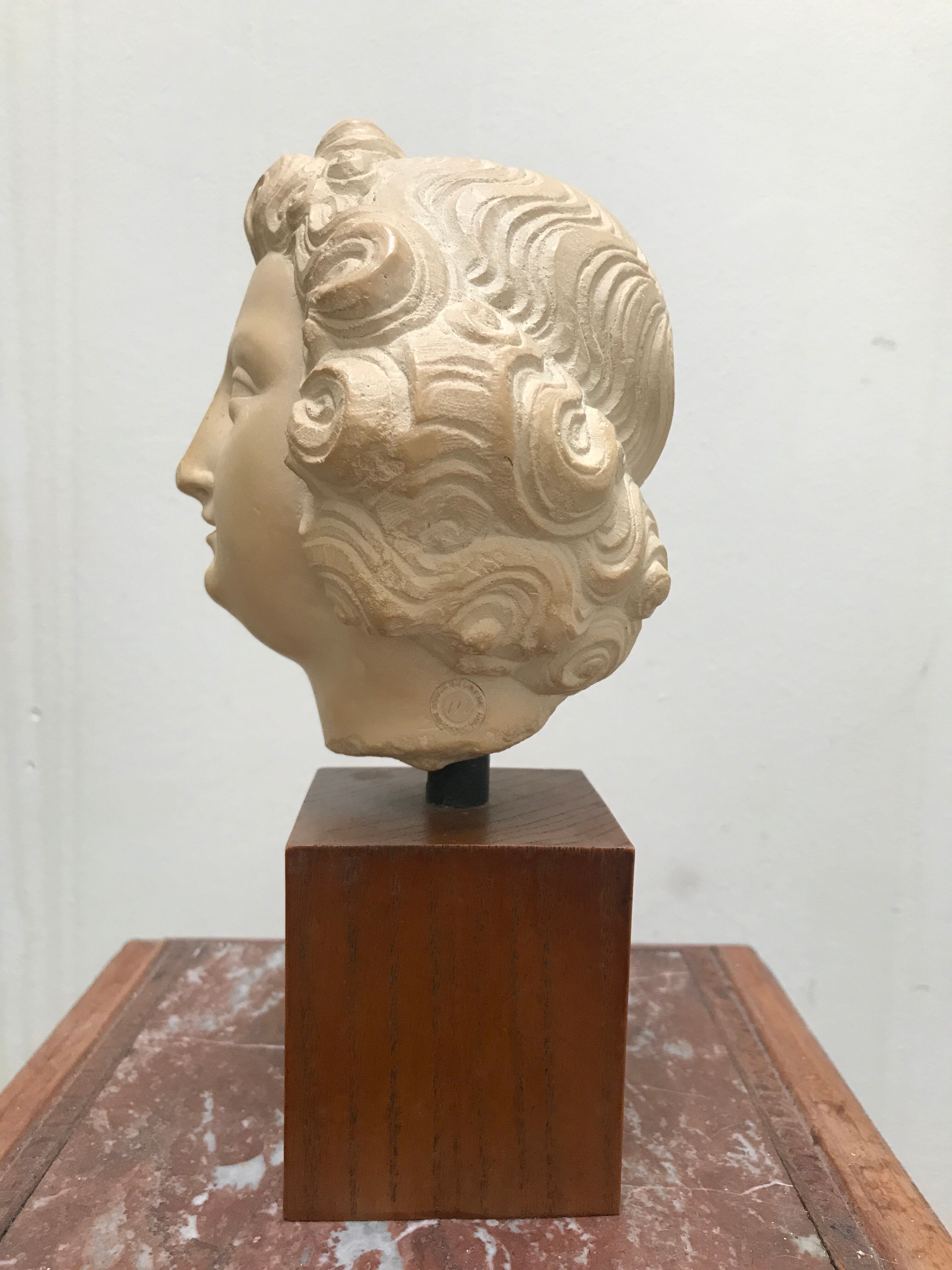 Bust angel head Louvre Museum