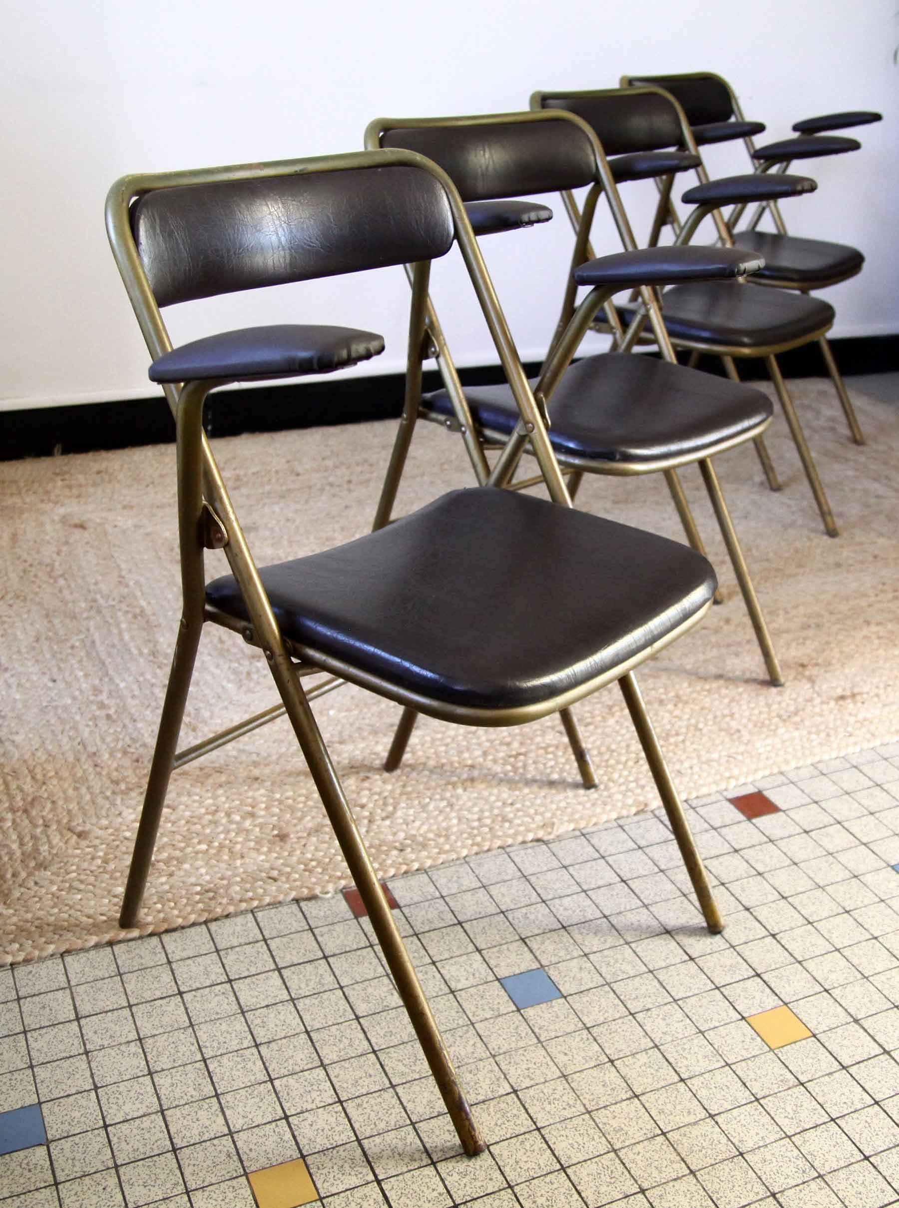 Lot of 4 metal and skai folding chairs