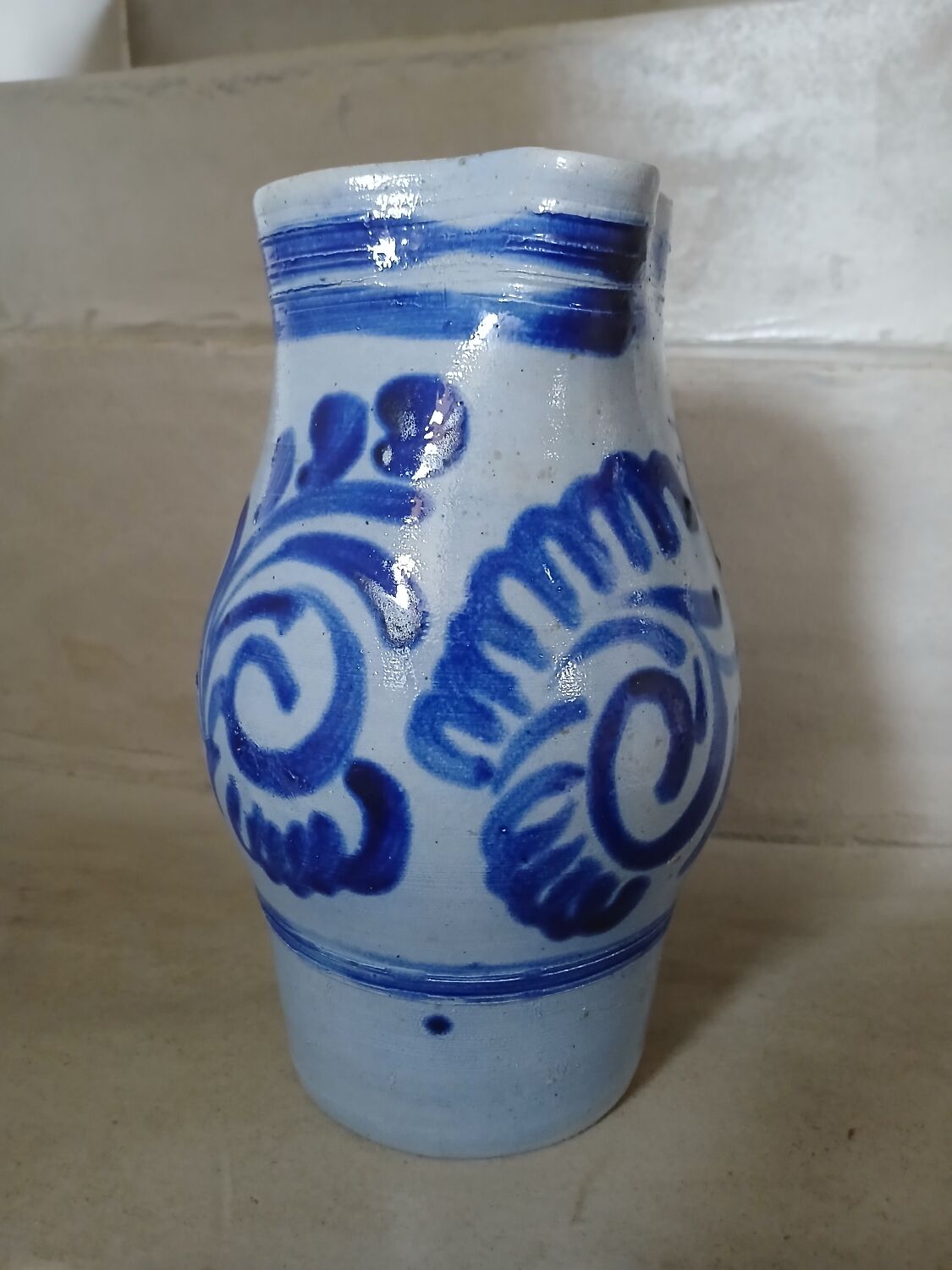 2 antique stoneware pitchers