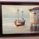 Small marine painting of a boat in oil on panel.
