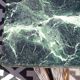 Flamed mahogany enfilade with sea green marble in Empire style.