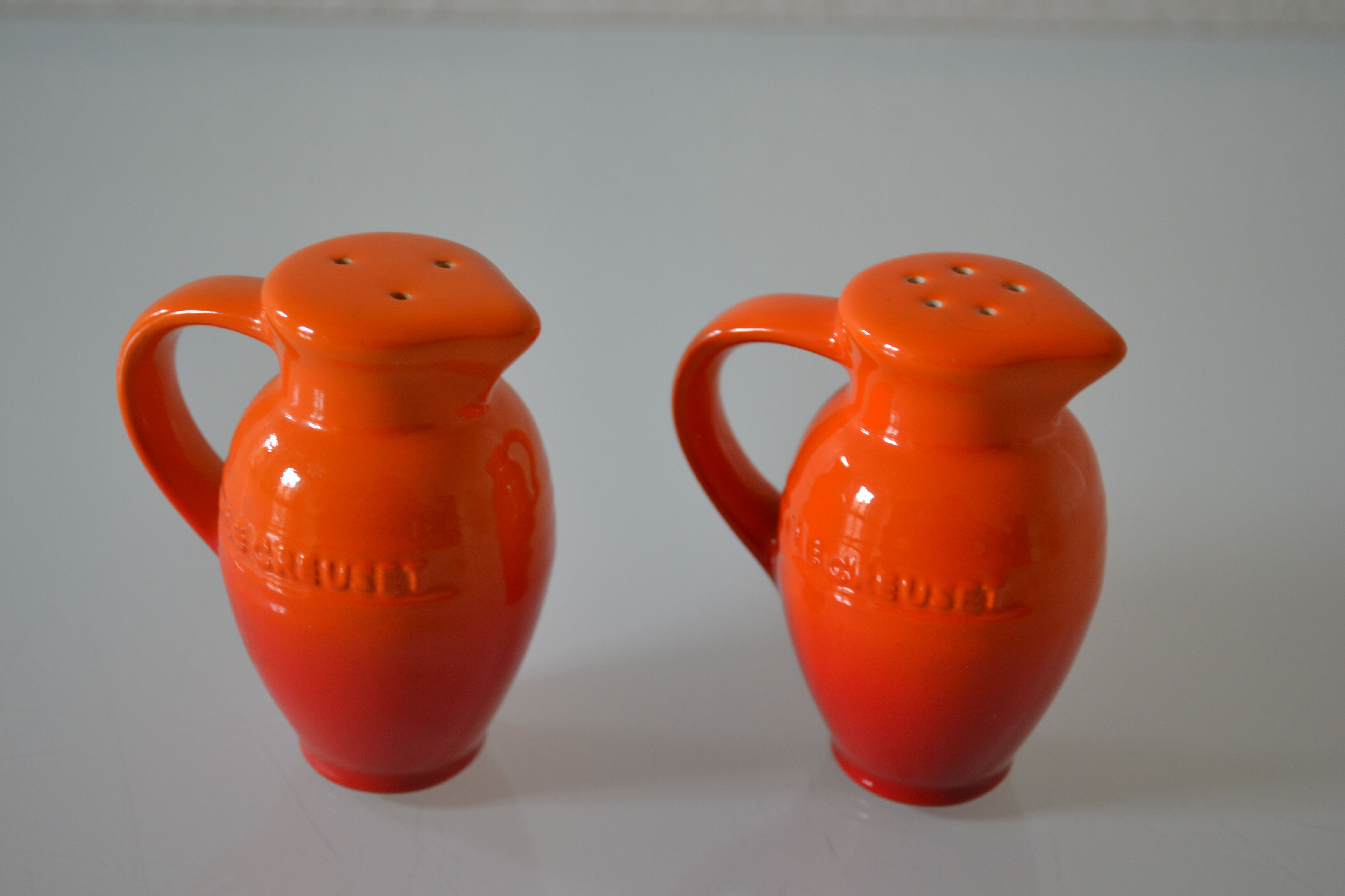 Le Creuset orange advertising salt and pepper