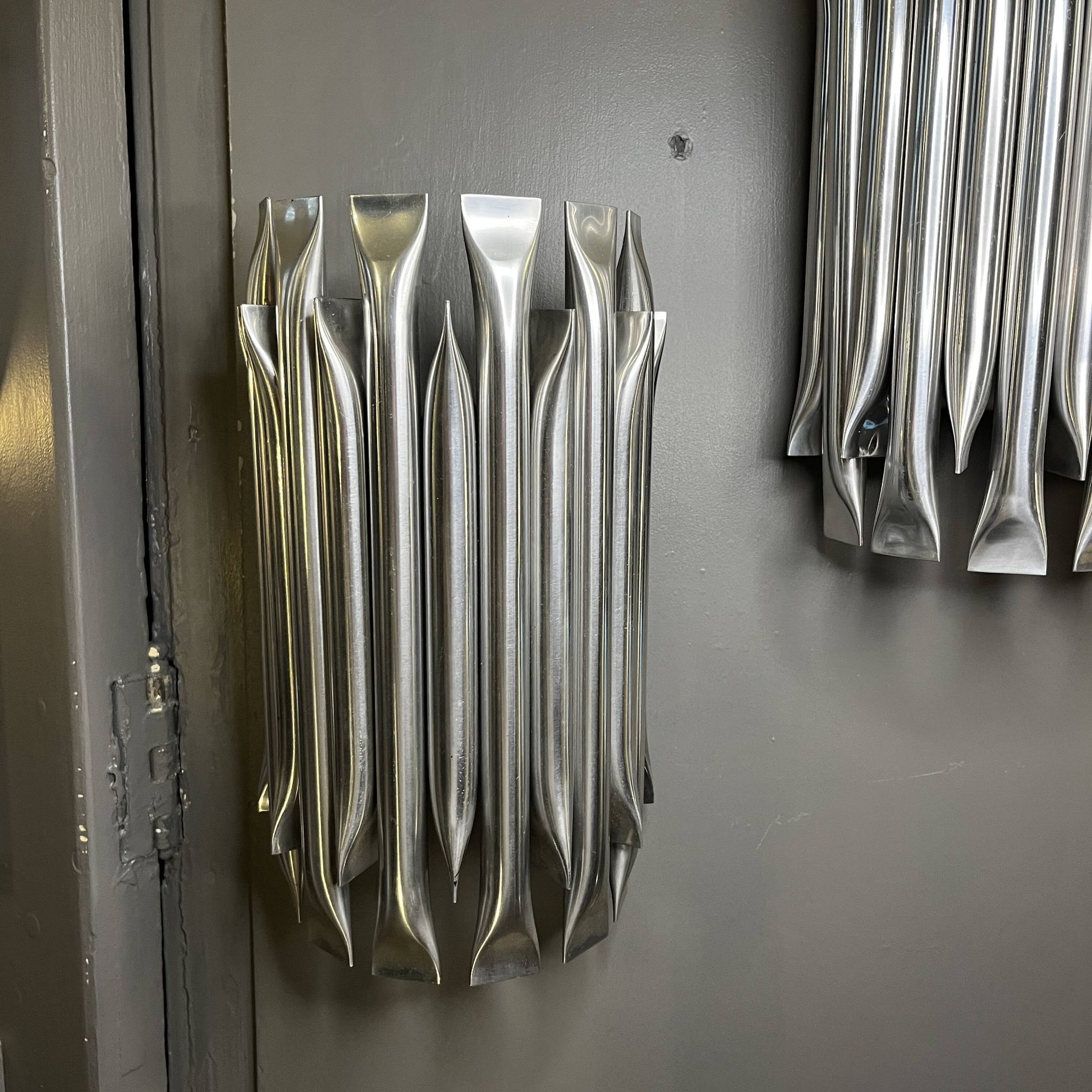 Raak 'concorde' pair of wall lights, 'organ tube' type in brushed aluminium, ca 1970