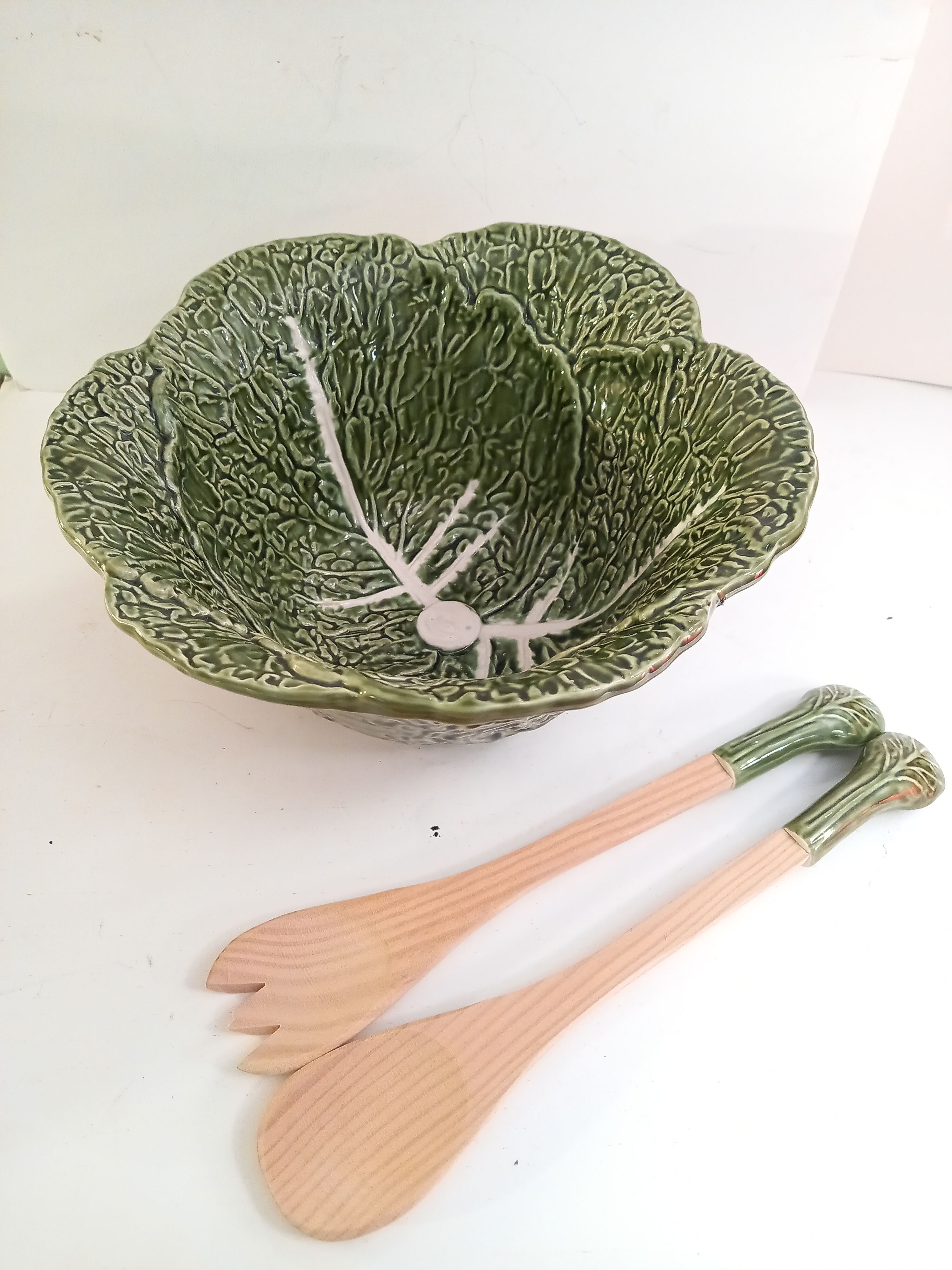 Vintage salad bowl in dabbling cabbage leaf and cutlery