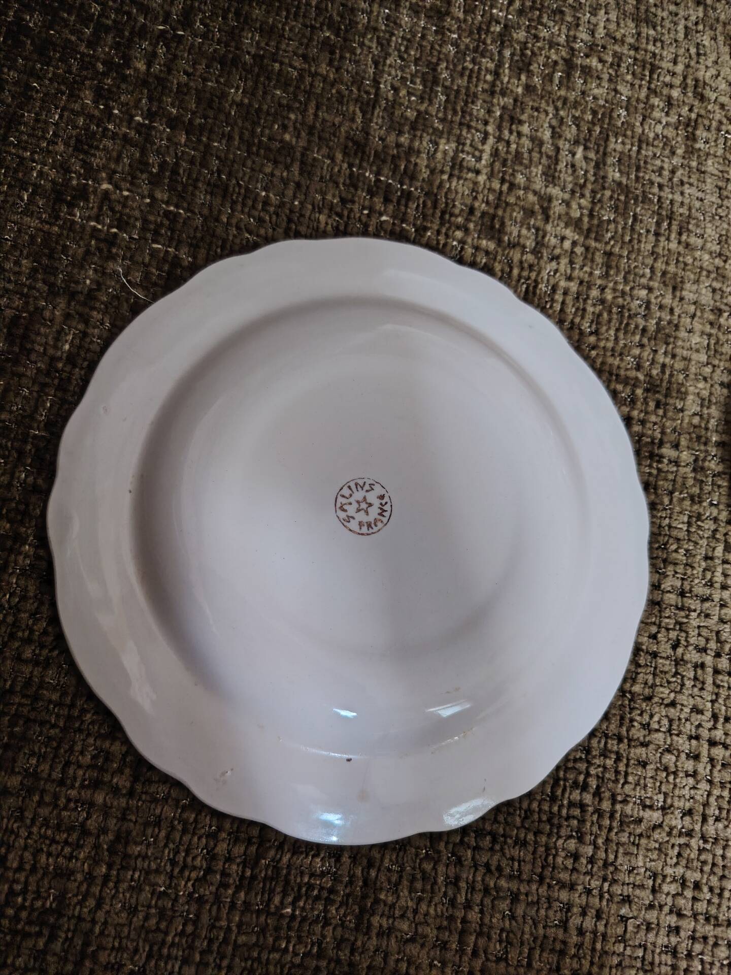 Salins white ceramic dessert plates with red trim and gold rim.