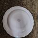 Salins white ceramic dessert plates with red trim and gold rim.