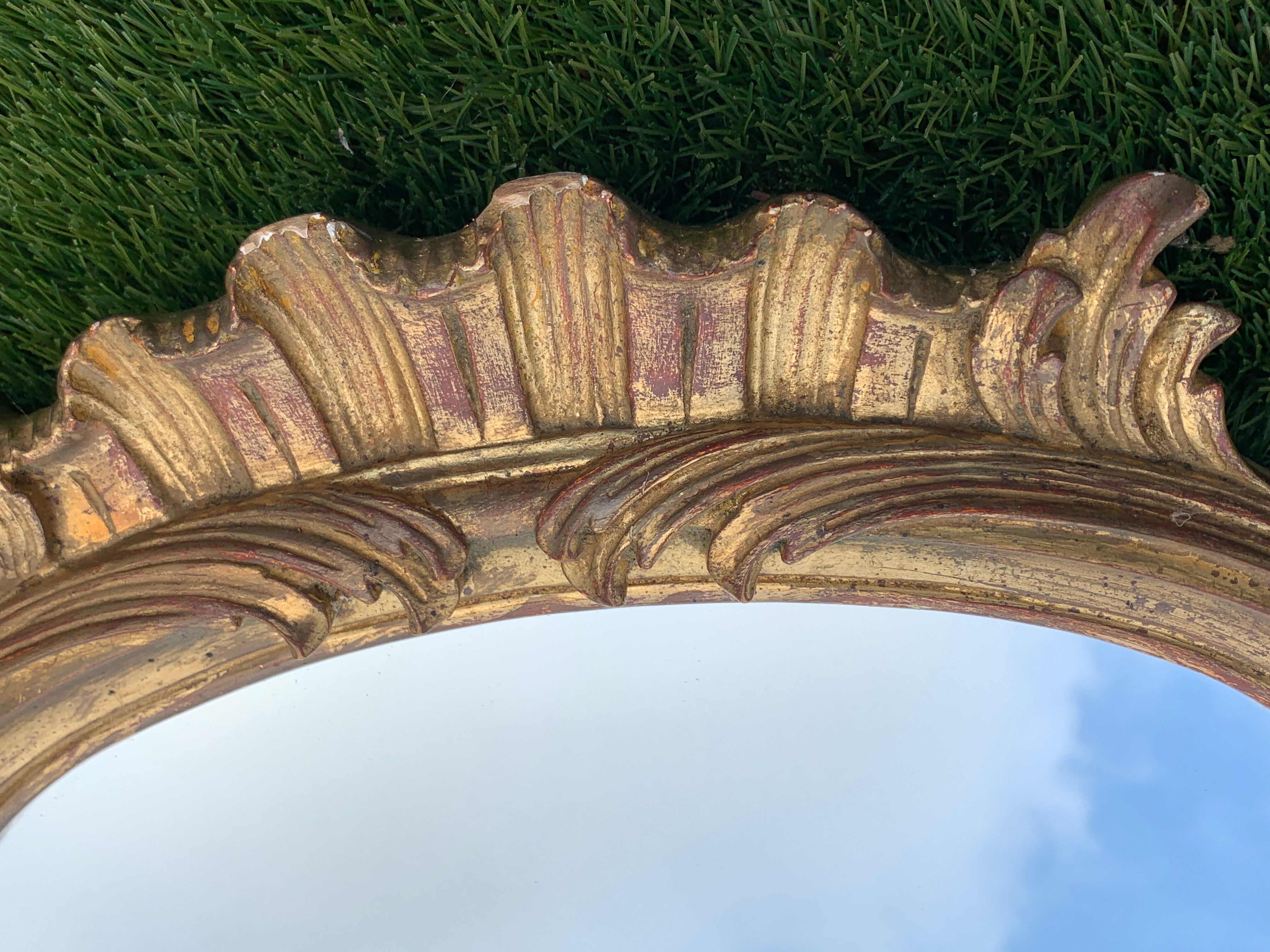 Old mirror in carved wood and gilded leaf, Louis XV rocaille style, twentieth century 59x87cm