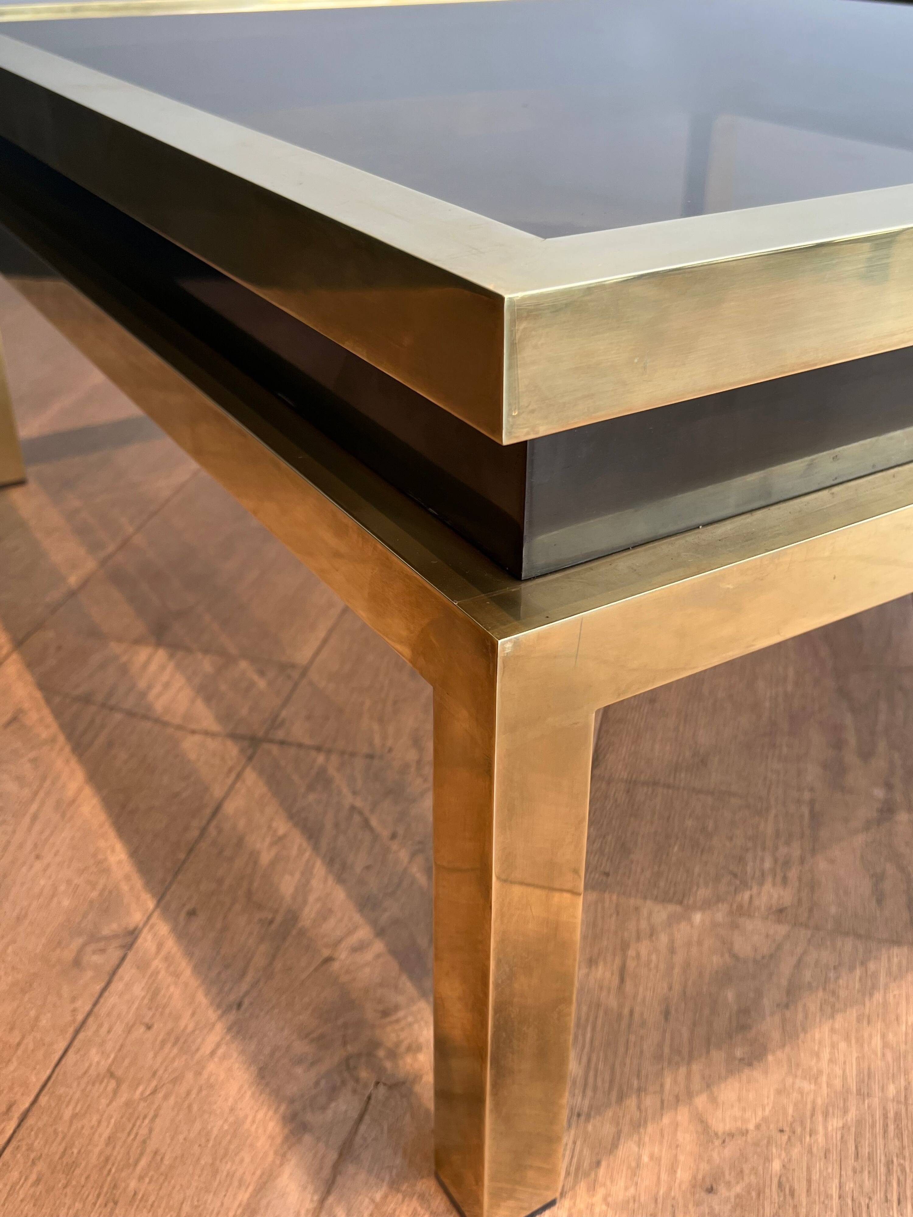 Coffee table in brass and black lacquer by Guy Lefèvre for Maison Jansen