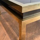 Coffee table in brass and black lacquer by Guy Lefèvre for Maison Jansen