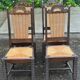 4 Basque solid wood dining chairs with carved straw seats.
