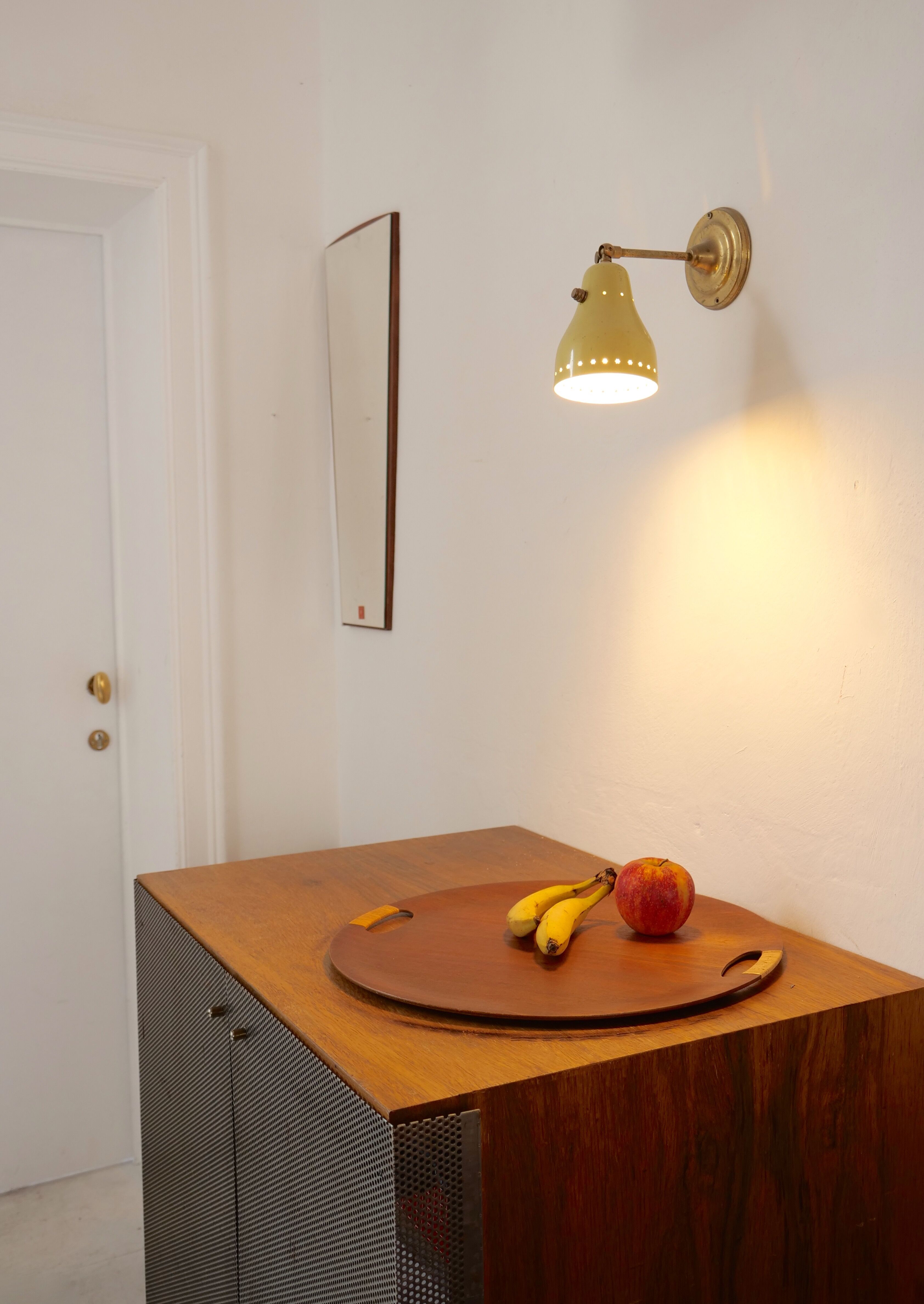 Wall lamp inlaiton and pale yellow lacquered metal
