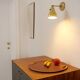 Wall lamp inlaiton and pale yellow lacquered metal
