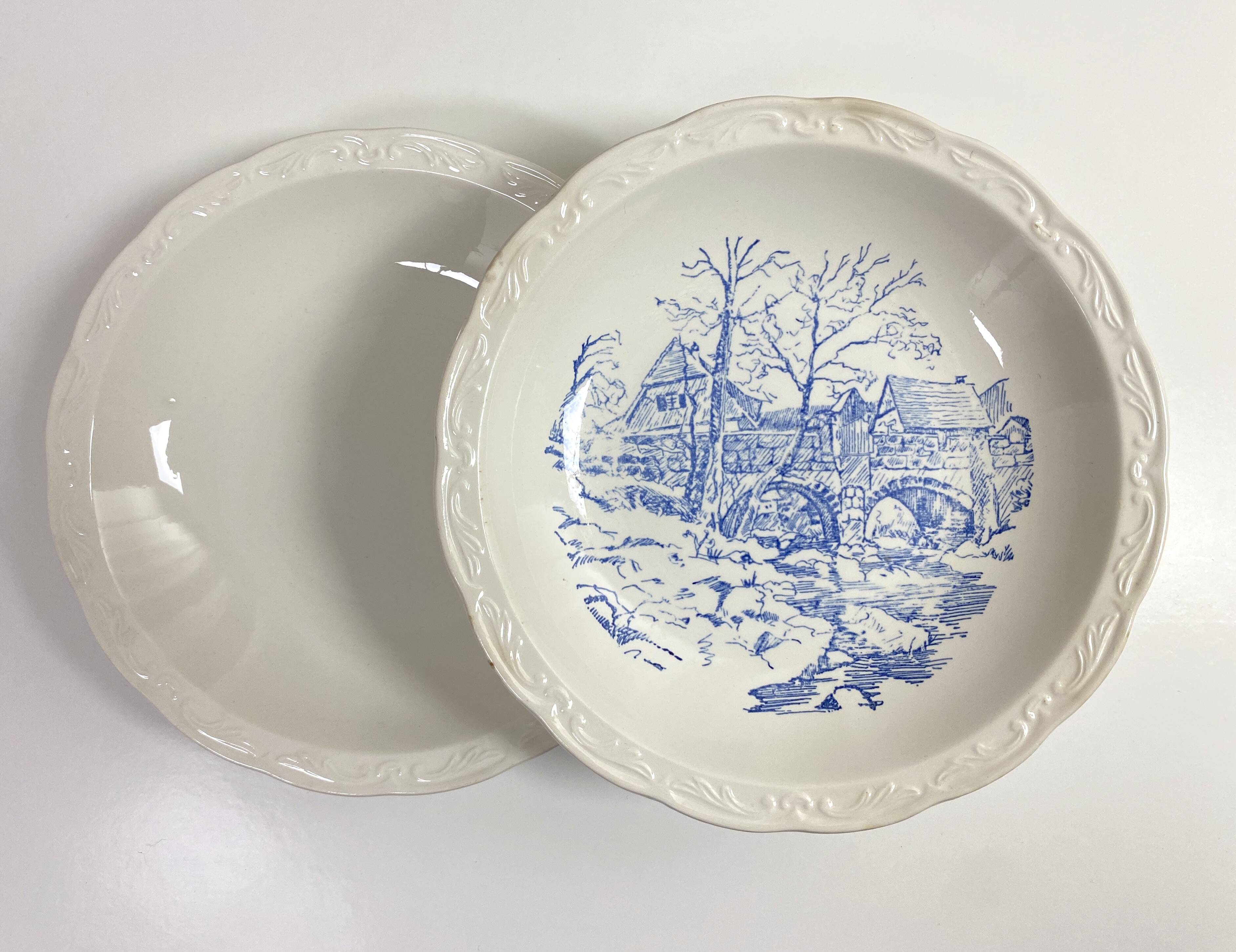 Set of two matching soup plates, one plain and one decorated