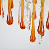 A pair of Mid Century 70's waterfall chandeliers. Murano glass amber drops. Paolo Venini style.