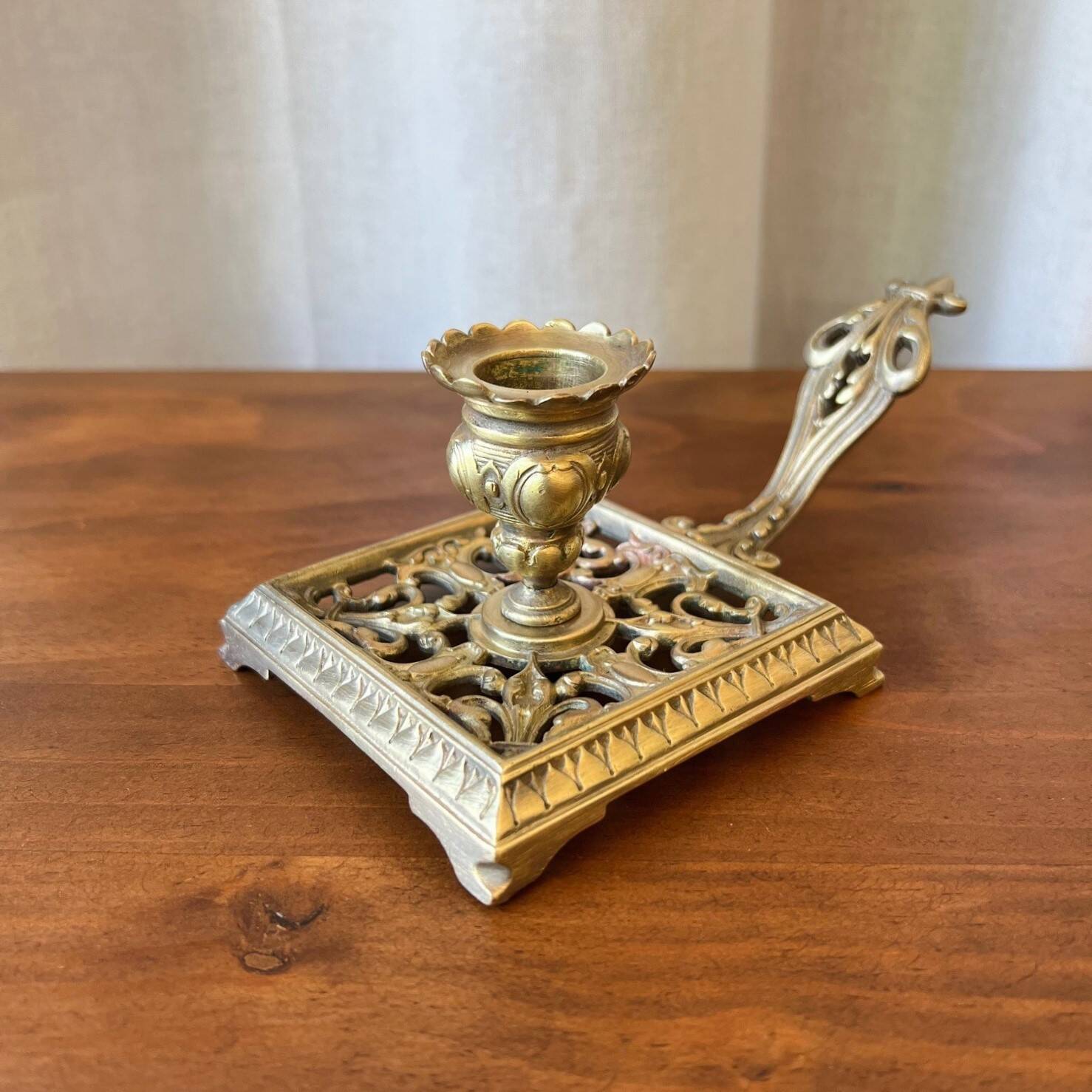 Bronze cellar rat candle holder