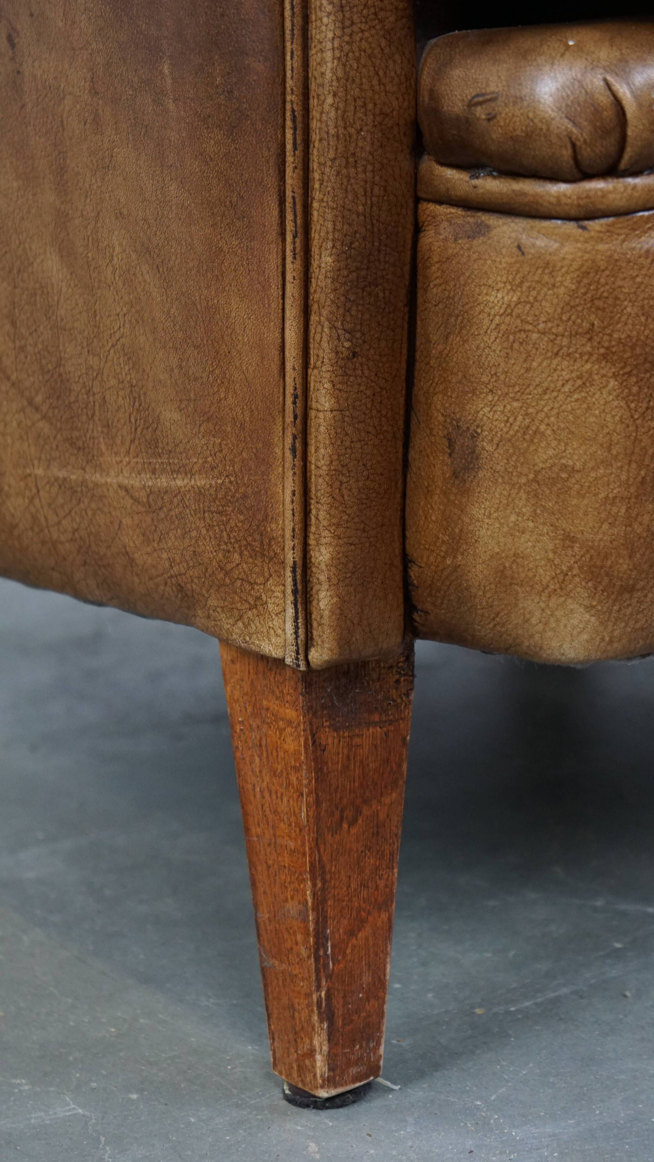 Fauteuil club en cuir de vachette couleur cognac clair