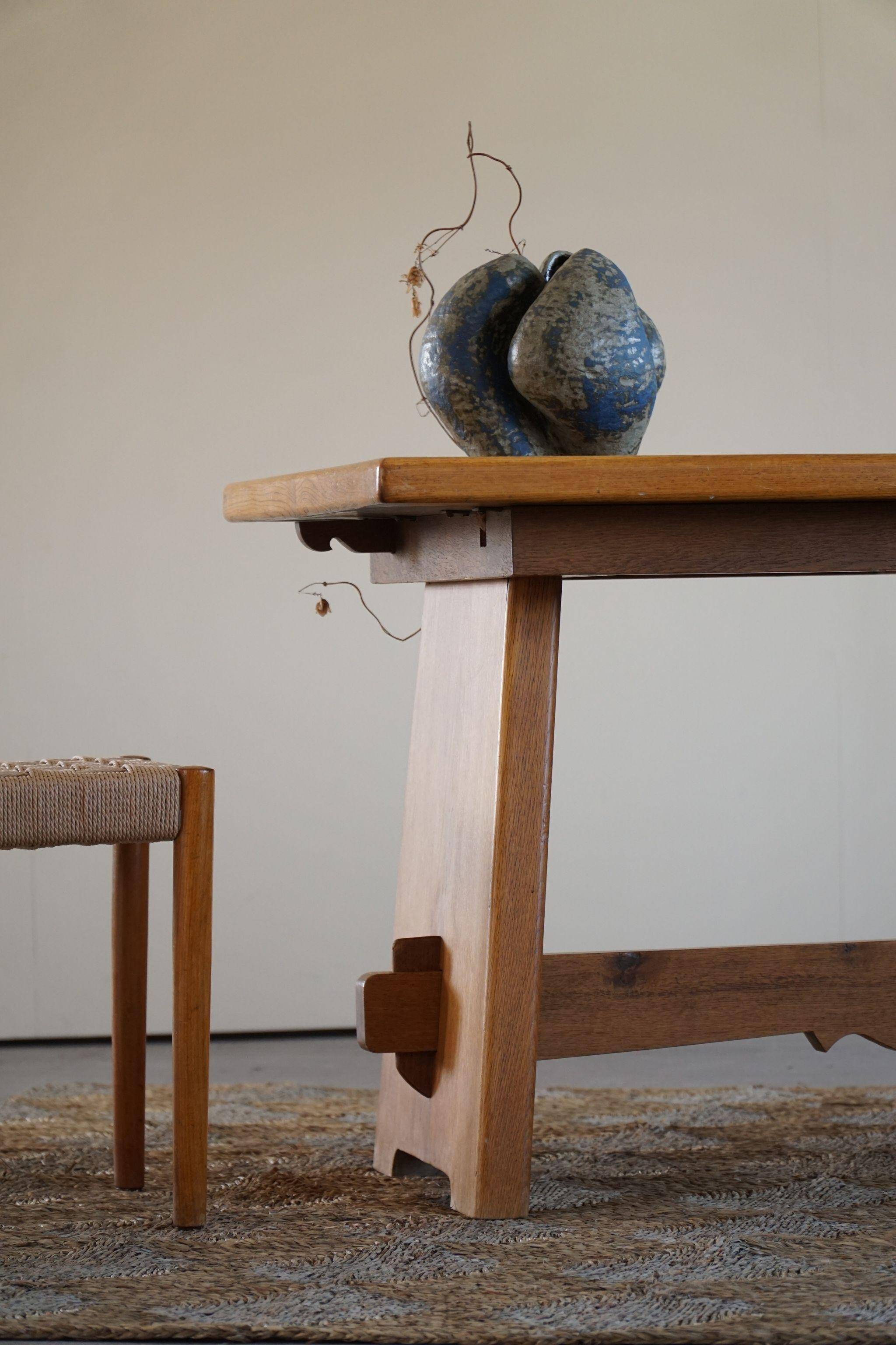 Mid-century brutalist dining table, made of oak, Danish craftsmanship, 1950s.