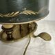 A pair of old brass bed warmers.