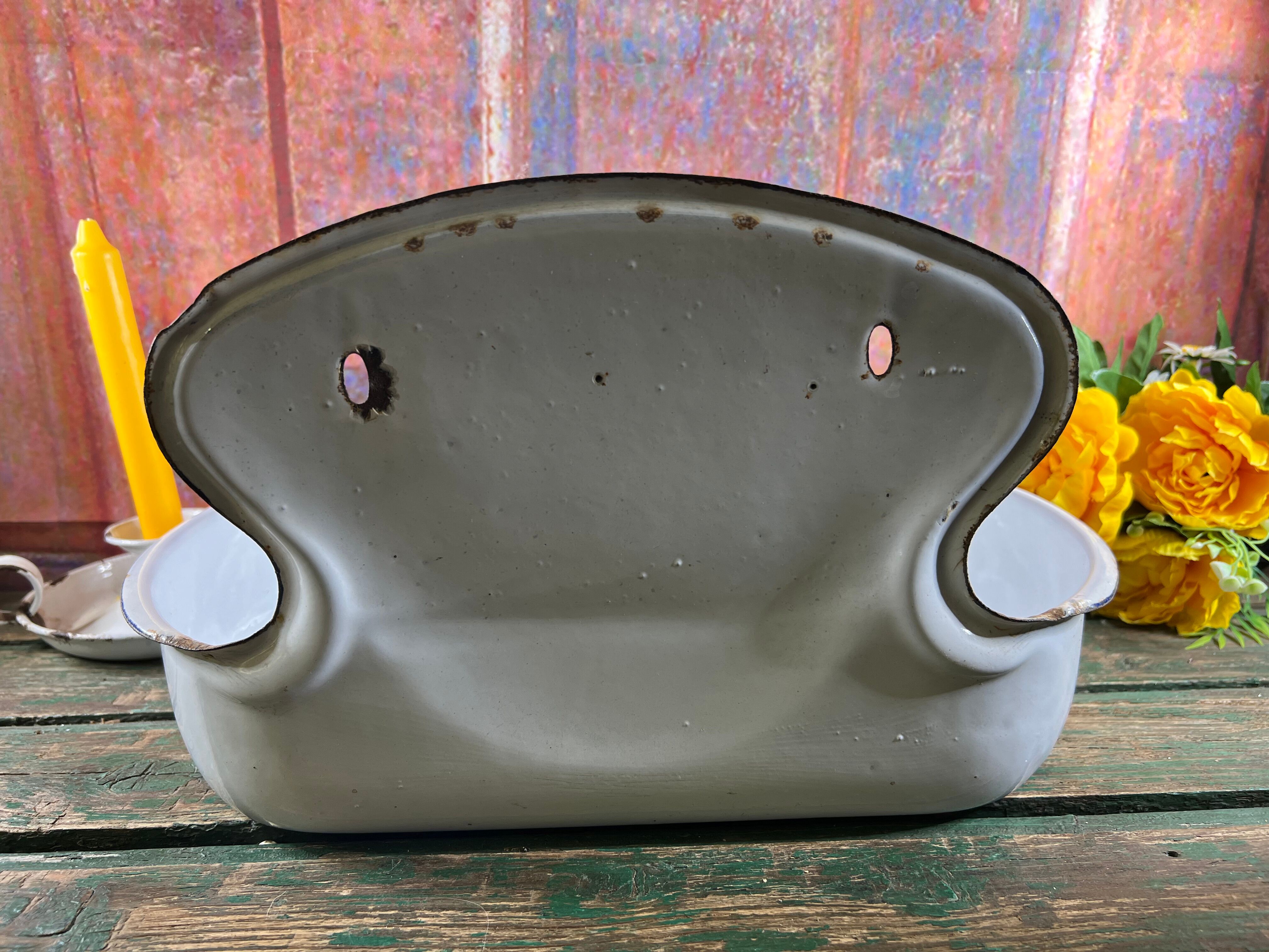 Old white enamelled hand washbasin or gardener enamel garden
