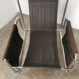Velvet and tubular metal armchair 1980