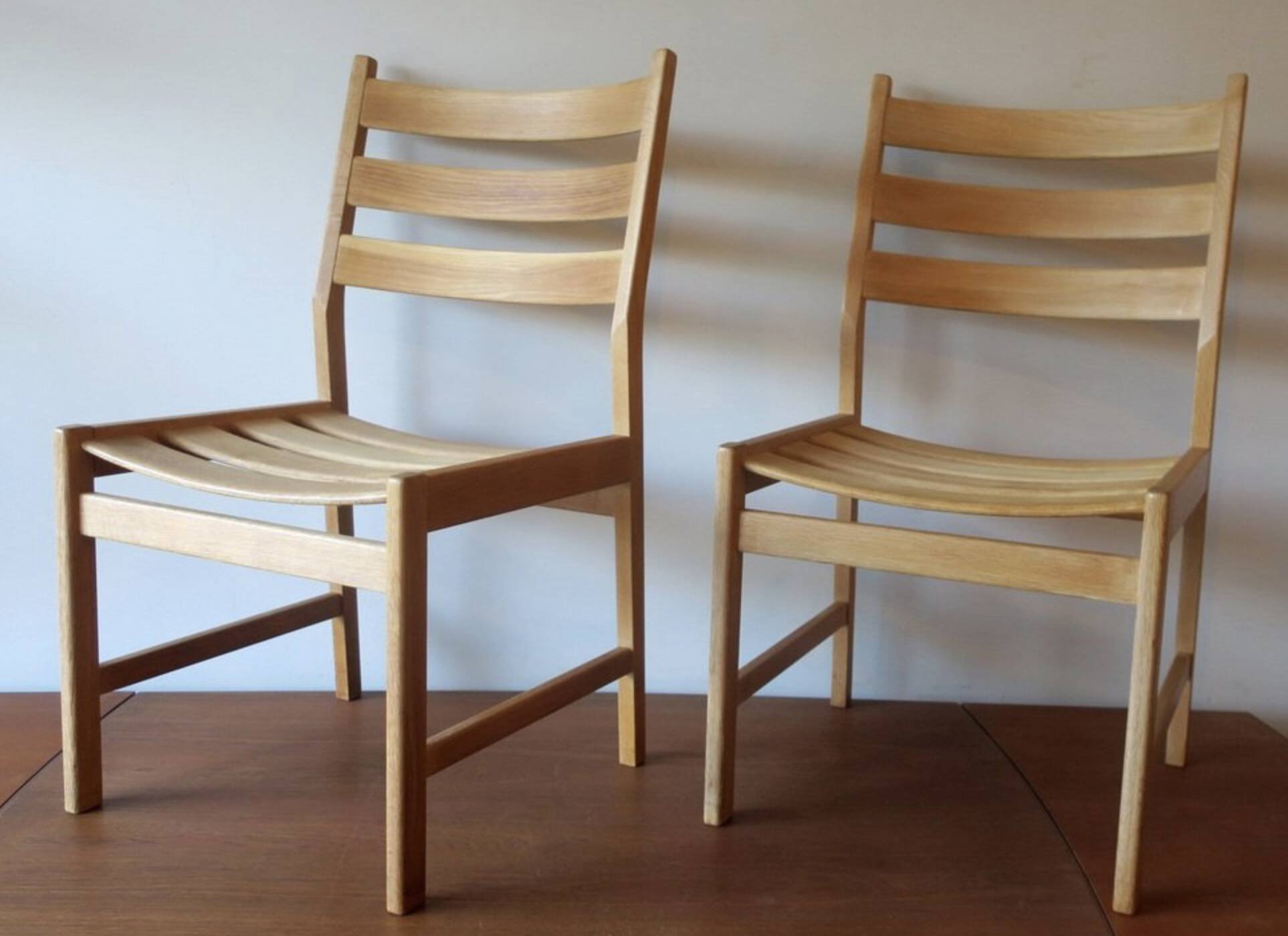 Pair of solid ash wide-seat dining chairs by Kurt Ostervig for KP Mobler, Denmark 1950s
