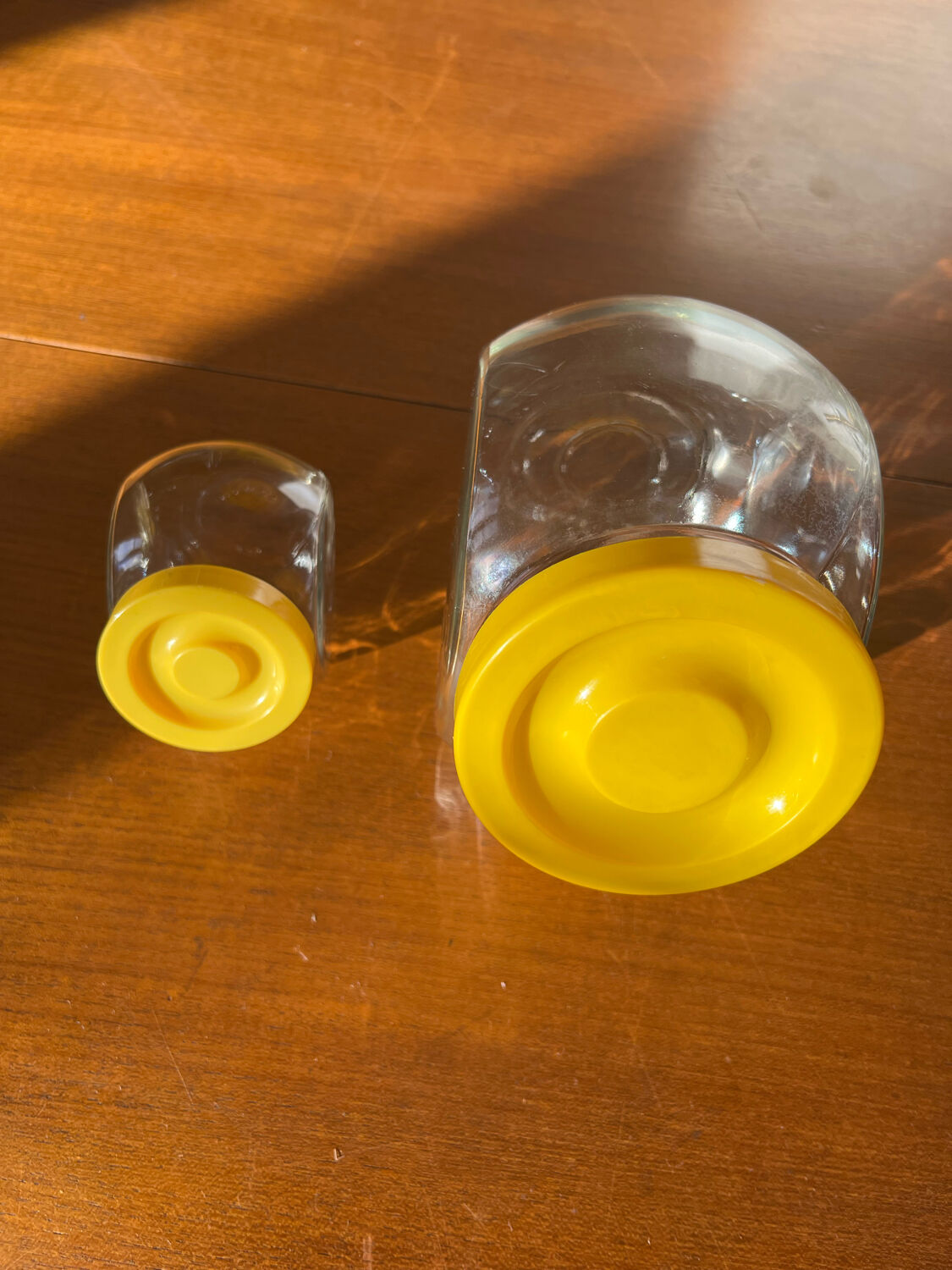 Pair of yellow vintage candy jars