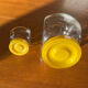 Pair of yellow vintage candy jars