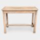 Art Deco farmhouse table made of raw wood.
