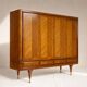 Vintage 4-door chevron wood wardrobe with mirror and gold legs.