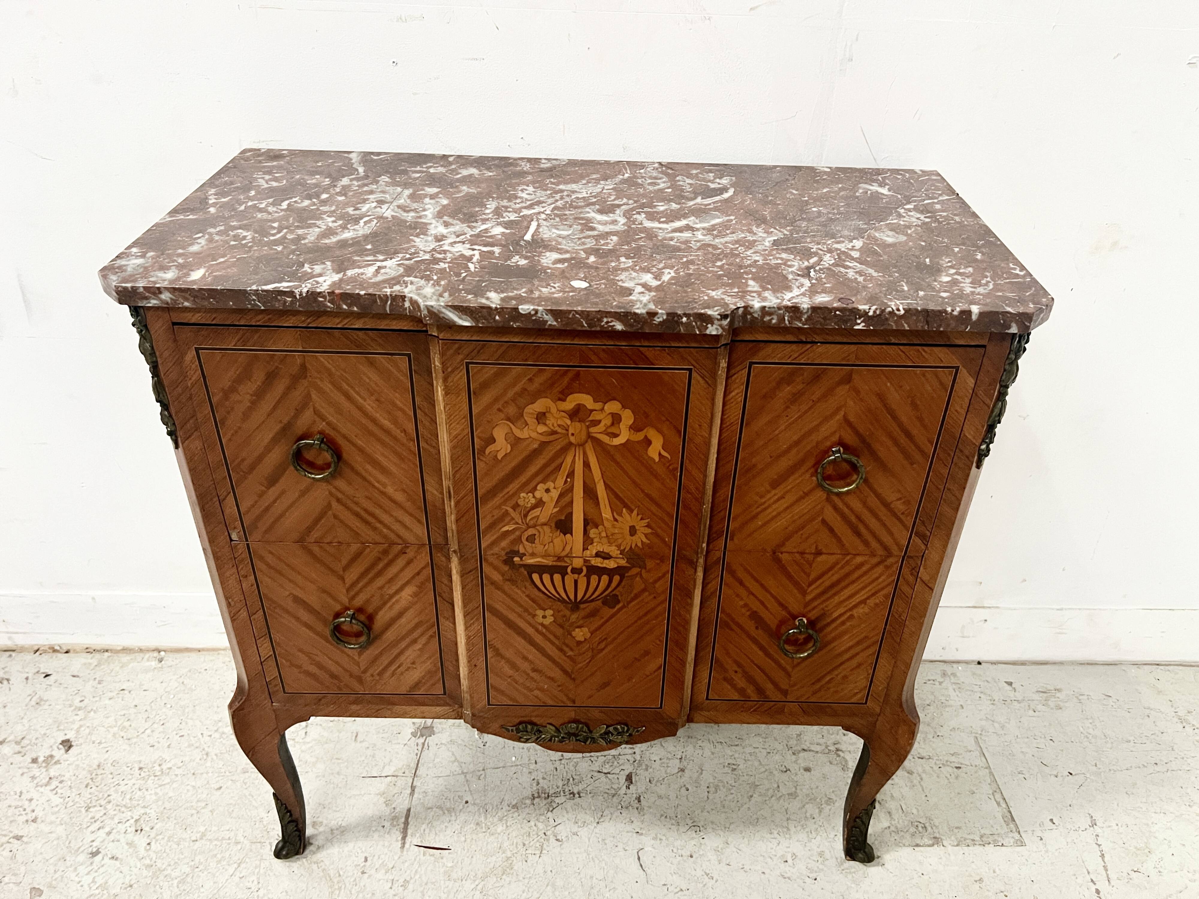 Transitional style commode with a protruding front, in marquetry wood, 20th century.
