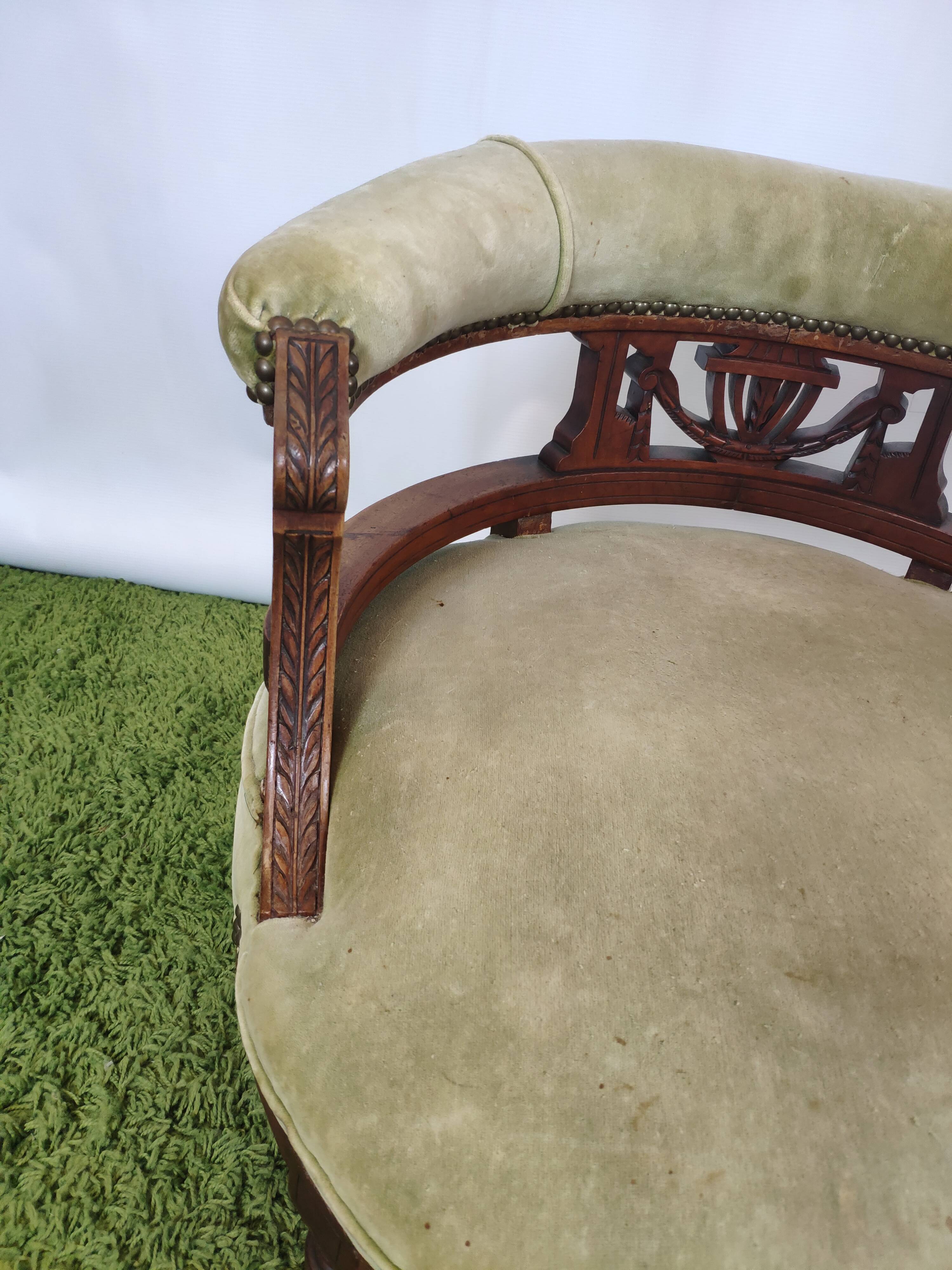 Old green velvet empire chair