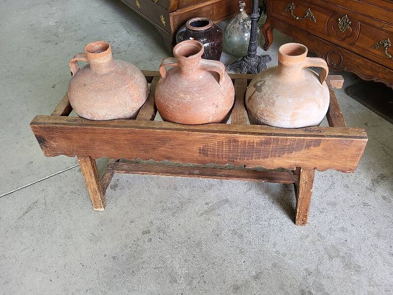Old wooden jar holder with 3 clay jars