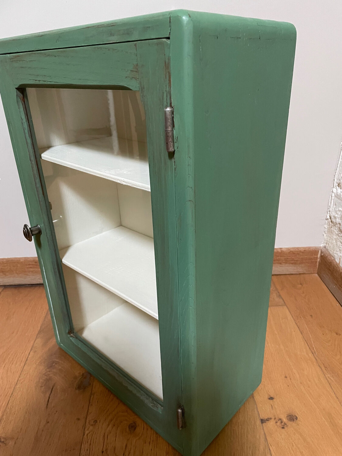 Small wooden cabinet patinated arsenic green