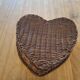 Small wicker basket in the shape of a heart.