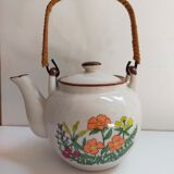 Flowered stoneware teapot with vintage rattan handle