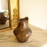 Old solid metal pitcher
