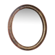 Old oval mirror in gilded wood