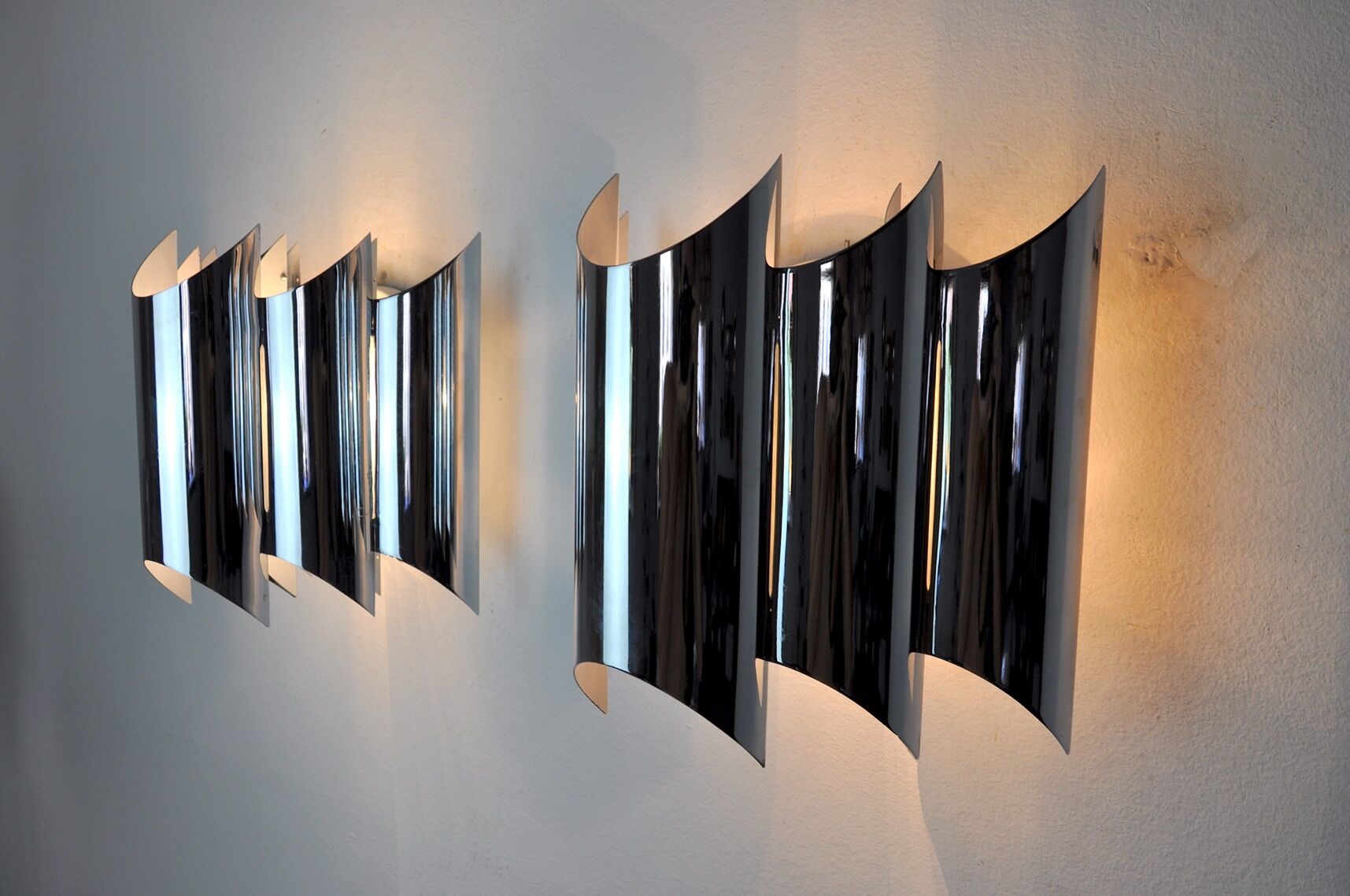 Pair of Raak wall lamps, space-age chrome design, Germany, 1970