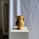 Large antique handmade ochre yellow jug with a pink flower pattern.