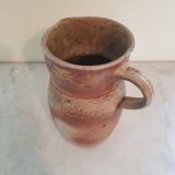 Pitcher in varnished sandstone