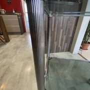 Serving dessert trolley with 2 smoked glass shelves and metal structure.