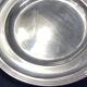 Circular silver-plated metal dish signed ercuis