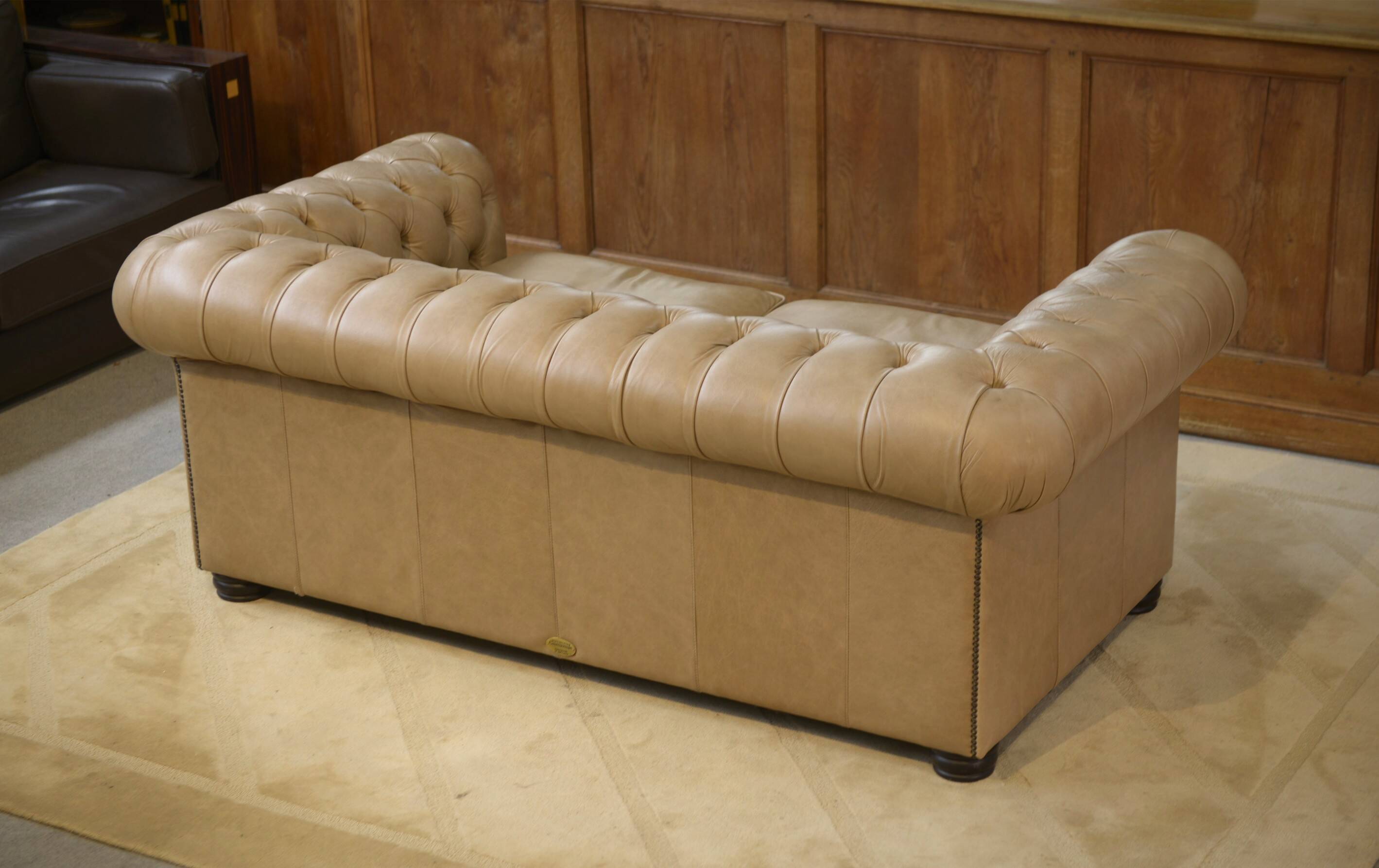 Beige leather Chesterfield sofa handmade in England.