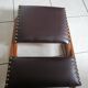 Vintage rocking footrests in wood and faux leather