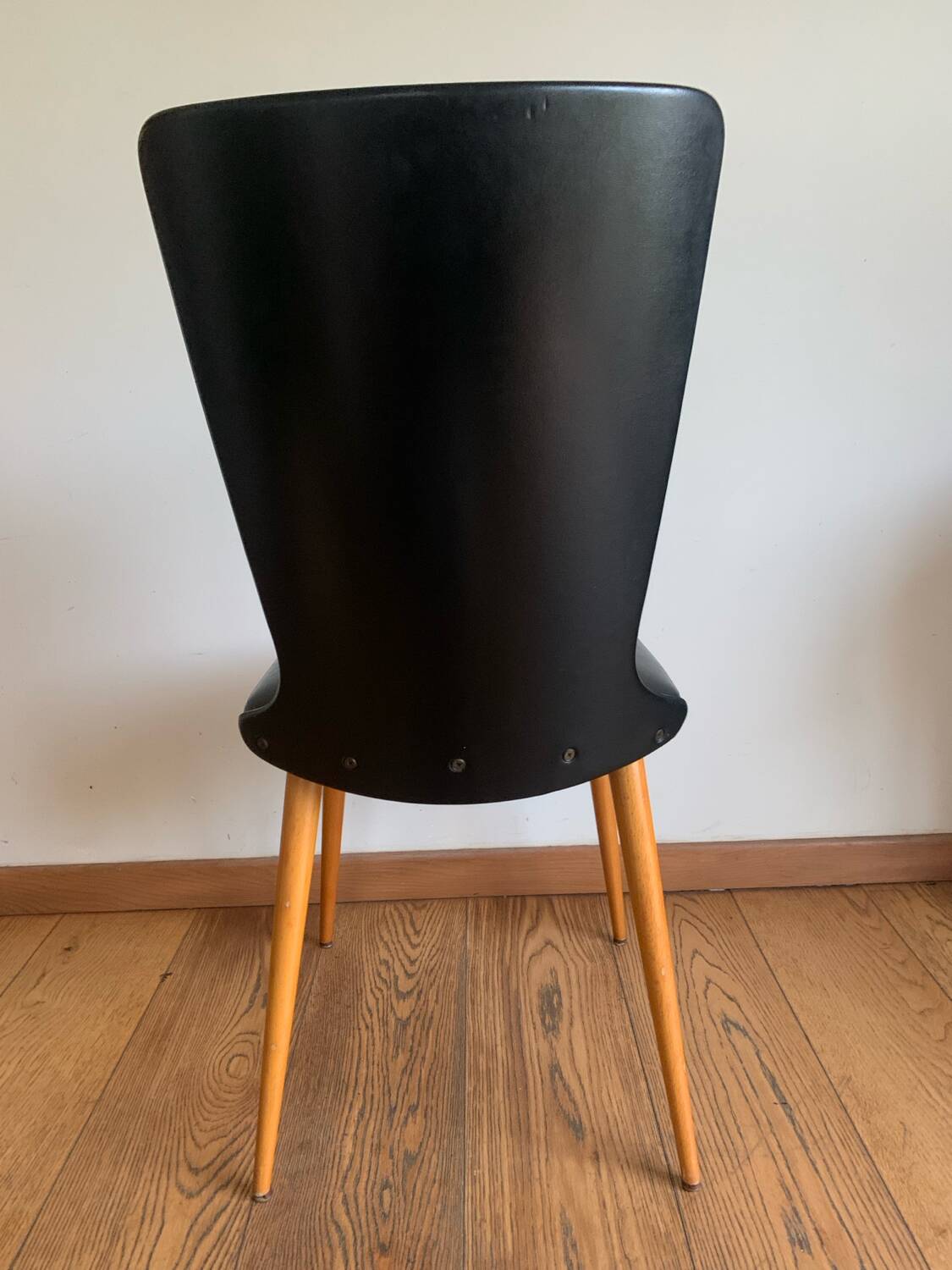 Black chair with compass legs