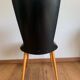 Black chair with compass legs