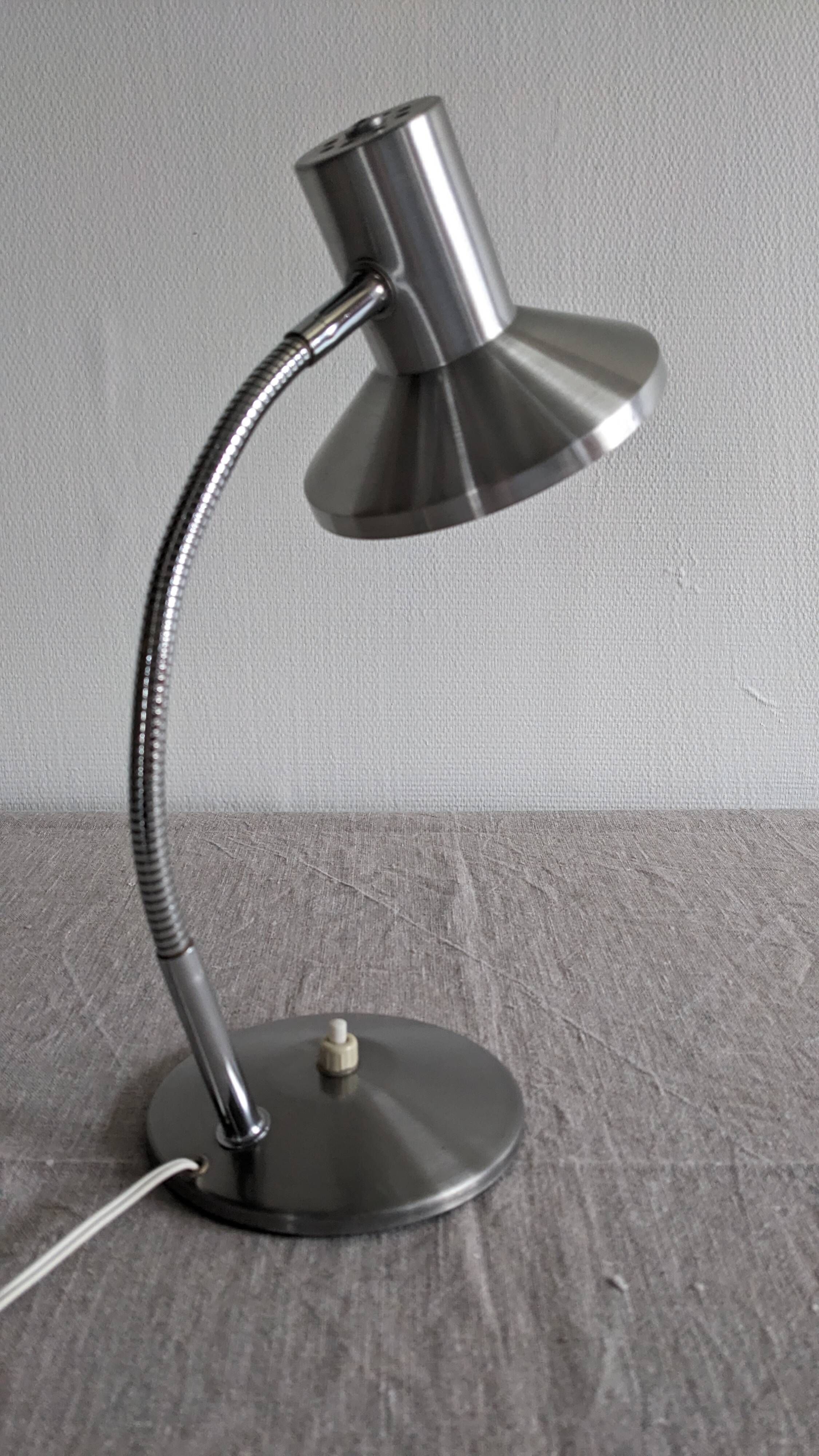 Articulated bedside lamp or wall light in aluminium, France circa 1960.