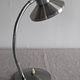 Articulated bedside lamp or wall light in aluminium, France circa 1960.