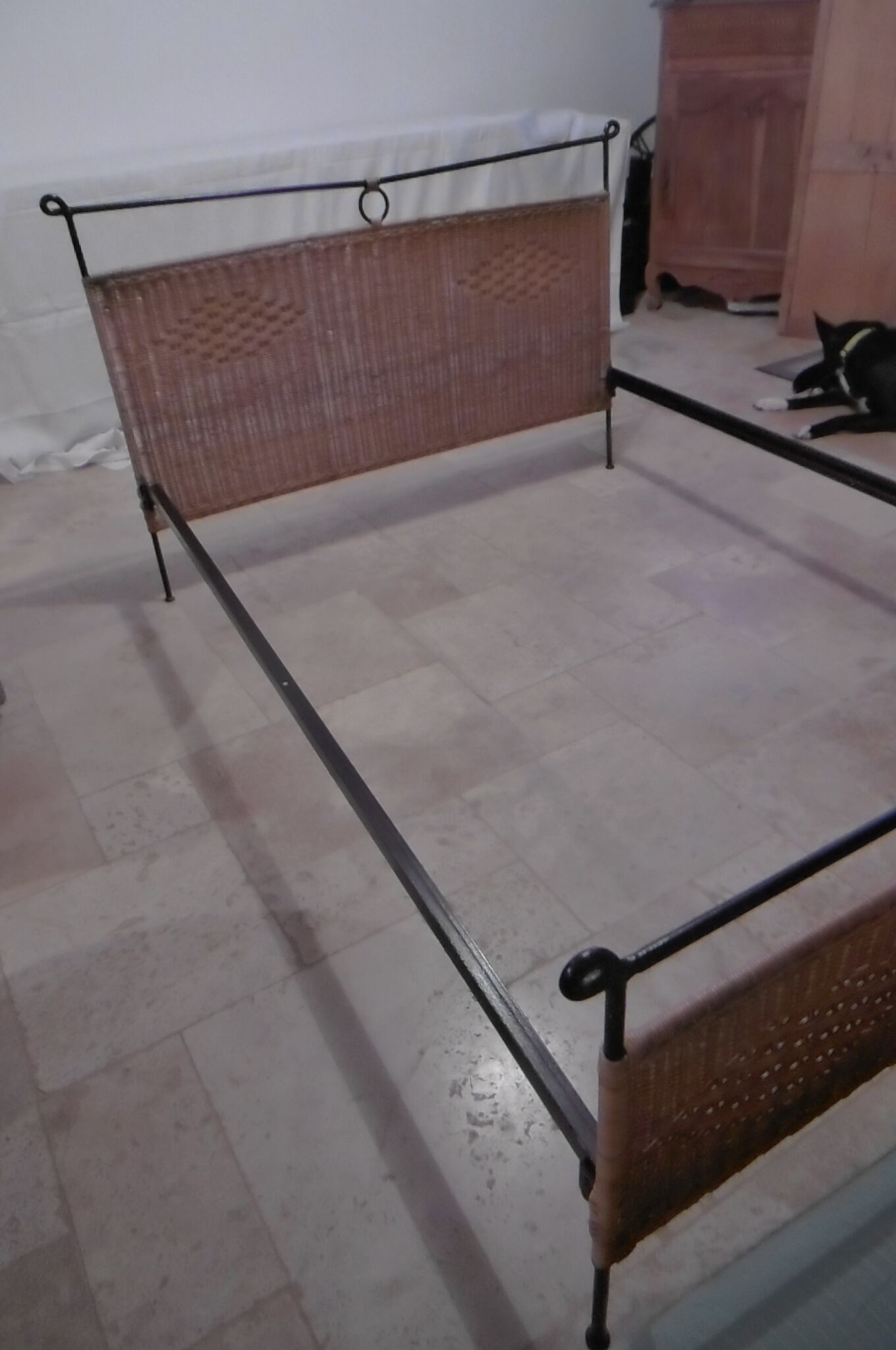 Black metal and rattan bed frame